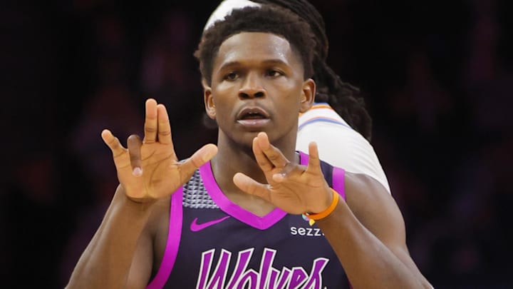 Dec 19, 2025; Minneapolis, Minnesota, USA; Minnesota Timberwolves guard Anthony Edwards (5) celebrates his three-point basket to the Oklahoma City Thunder bench in the third quarter at Target Center. Mandatory Credit: Bruce Kluckhohn-Imagn Images