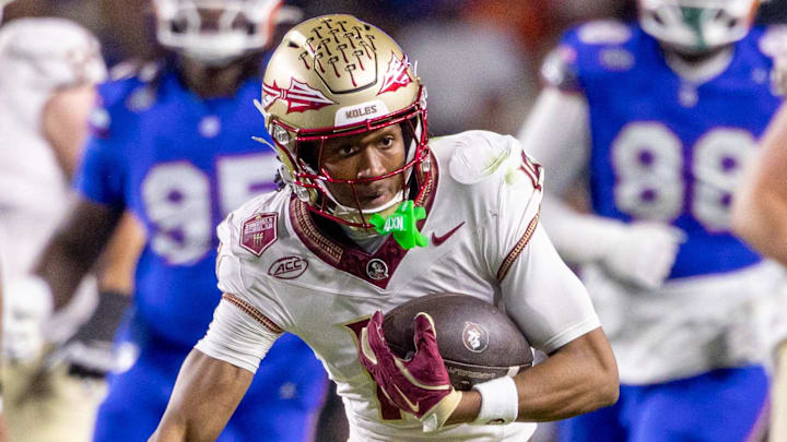 Nov 29, 2025; Gainesville, Florida, USA; Florida State Seminoles wide receiver Micahi Danzy (19) runs the ball during the third quarter against the Florida State Seminoles at Ben Hill Griffin Stadium. Mandatory Credit: Bob Kupbens-Imagn Images