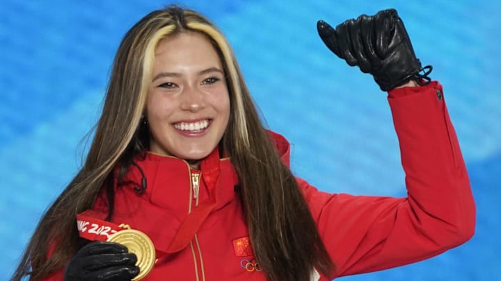 Feb 18, 2022; Zhangjiakou, CHINA; Gold medalist Ailing Eileen Gu (CHN) celebrates during the medals ceremony for the women's freestyle skiing halfpipe at the Beijing 2022 Olympic Winter Games at Zhangjiakou Medals Plaza. Mandatory Credit: Jack Gruber-Imagn Images
