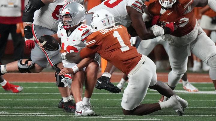 Sep 12, 2026; Austin, Texas, USA;  Texas Longhorns defensive end Colin Simmons sacks Ohio State Buckeyes quarterback Julian Sayin
