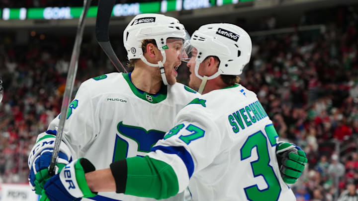 Feb 27, 2025; Raleigh, North Carolina, USA;  Carolina Hurricanes right wing Mikko Rantanen (96) celebrates his goal with right wing Andrei Svechnikov (37) against the Buffalo Sabres during the first period at Lenovo Center. Mandatory Credit: James Guillory-Imagn Images
