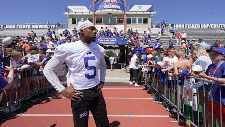 Buffalo Bills wide receiver Joshua Palmer looks for his helmet after it disappeared while he was signing autographs.