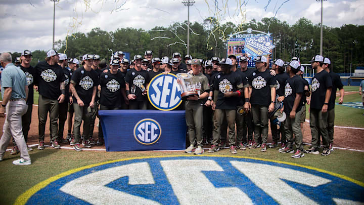 Vanderbilt Commodores head coach Tim Corbin and his team celebrate with the championship trophy as Ole Miss Rebels take on Vanderbilt Commodores during the SEC baseball tournament championship game at Hoover Met in Birmingham, Ala., on Sunday, May 25, 2025. Vanderbilt Commodores defeated Ole Miss Rebels 3-2.