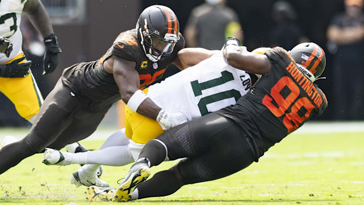 Sep 21, 2025; Cleveland, Ohio, USA; Cleveland Browns defensive end Myles Garrett (95) and defensive end Adin Huntington (98) sack Green Bay Packers quarterback Jordan Love (10) during the second quarter at Huntington Bank Field. Mandatory Credit: Scott Galvin-Imagn Images
