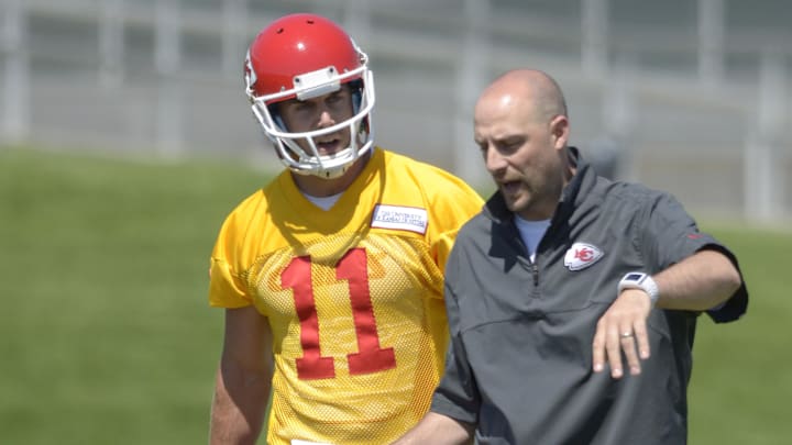 May 15, 2013; Kansas City, MO, USA; Kansas City Chiefs quarterback Alex Smith (11) talks with