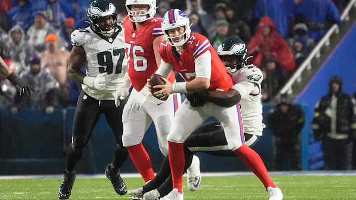 Dec 28, 2025; Orchard Park, New York, USA; Philadelphia Eagles linebacker Jalyx Hunt (58) sacks Buffalo Bills quarterback Josh Allen (17) during the first quarter at Highmark Stadium.