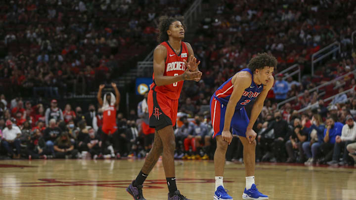 Nov 10, 2021; Houston, Texas, USA; Houston Rockets guard Jalen Green (0) and Detroit Pistons guard Cade Cunningham (2) watch a Houston Rockets free throw in the fourth quarter at Toyota Center. Mandatory Credit: Thomas Shea-Imagn Images