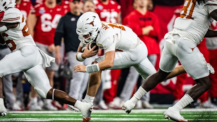 Texas Longhorns quarterback Arch Manning (16) carries the ball for a first down in the second quarter as the Texas Longhorns play the Ohio State Buckeyes in the Cotton Bowl College Football Playoff semi-final at AT&T Stadium in Dallas, Texas, Jan. 10, 2025. Texas Longhorns quarterback Arch Manning (16) carries the ball for a first down in the second quarter as the Texas Longhorns play the Ohio State Buckeyes in the Cotton Bowl College Football Playoff semi-final at AT&T Stadium in Dallas, Texas, Jan. 10, 2025.