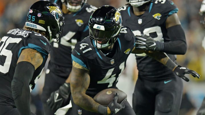 Jacksonville Jaguars linebacker Josh Allen (41) celebrates with teammates after interception a Cincinnati Bengals pass during fourth quarter action. The Jacksonville Jaguars hosted the Cincinnati Bengals at EverBank Stadium in Jacksonville, Florida for Monday Night Football, December 4, 2023. The Jaguars were tied 14 to 14 at the end of the first half an fell in overtime with a final score of 34 to 31. [Bob Self/Florida Times-Union]