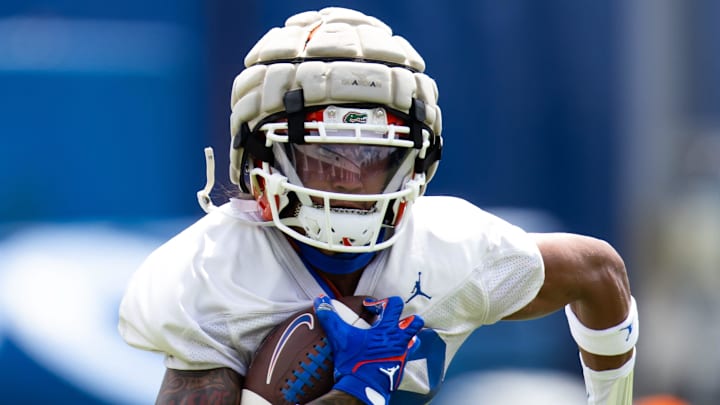 Florida Gators wide receiver Marcus Burke (88) Florida Gators running back Montrell Johnson Jr. (1) hauls in a pass during Fall practice at Sanders Practice Fields in Gainesville, FL on Thursday, August 1, 2024. [Doug Engle/Gainesville Sun]