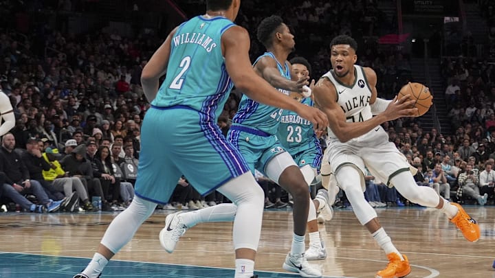 Feb 29, 2024; Charlotte, North Carolina, USA: Milwaukee Bucks forward Giannis Antetokounmpo (34) moves to the basket against Charlotte Hornets forward Grant Williams (2) and forward Brandon Miller (24) during the second quarter at Spectrum Center. Mandatory Credit: Jim Dedmon-Imagn Images Feb 29, 2024; Charlotte, North Carolina, USA: Milwaukee Bucks forward Giannis Antetokounmpo (34) moves to the basket against Charlotte Hornets forward Grant Williams (2) and forward Brandon Miller (24) during the second quarter at Spectrum Center. Mandatory Credit: Jim Dedmon-Imagn Images