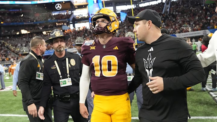 Arizona State quarterback Sam Leavitt (10) and Arizona State head coach Kenny Dillingham walk off the field after Texas won 39-31 in double overtime in the Chick-fil-A Peach Bowl in Atlanta on Jan. 1, 2025.