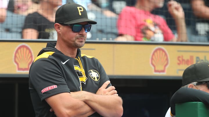 Aug 20, 2025; Pittsburgh, Pennsylvania, USA;  Pittsburgh Pirates manager Don Kelly (12) looks on from the dugout against the Toronto Blue Jays during the fifth inning at PNC Park. Mandatory Credit: Charles LeClaire-Imagn Images