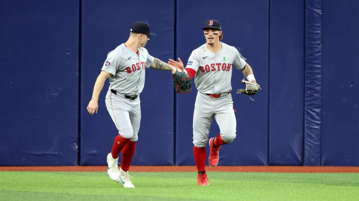 May 20, 2024; St. Petersburg, Florida, USA; Boston Red Sox outfielder Jarren Duran (16) is congratulated by outfielder Tyler O'Neill (17) after he caught the ball against the Tampa Bay Rays during the first inning at Tropicana Field. Mandatory Credit: Kim Klement Neitzel-USA TODAY Sports May 20, 2024; St. Petersburg, Florida, USA; Boston Red Sox outfielder Jarren Duran (16) is congratulated by outfielder Tyler O'Neill (17) after he caught the ball against the Tampa Bay Rays during the first inning at Tropicana Field. Mandatory Credit: Kim Klement Neitzel-USA TODAY Sports
