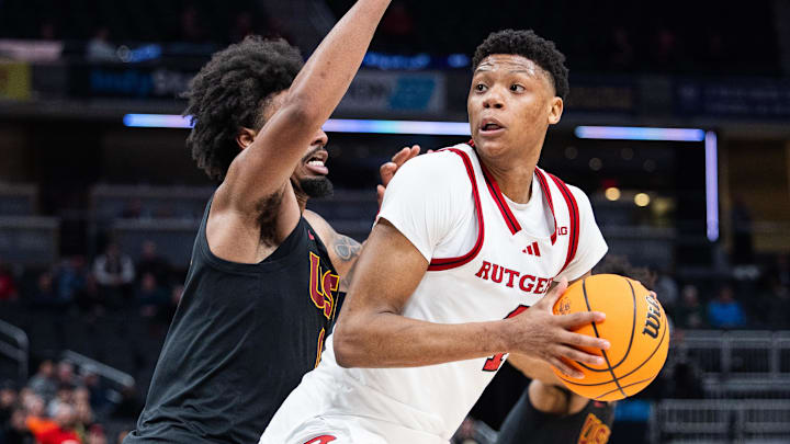 Mar 12, 2025; Indianapolis, IN, USA;  Rutgers Scarlet Knights guard Ace Bailey (4) shoots the ball while USC Trojans guard Kevin Patton Jr. (8) defends in the second half at Gainbridge Fieldhouse. Mandatory Credit: Trevor Ruszkowski-Imagn Images
