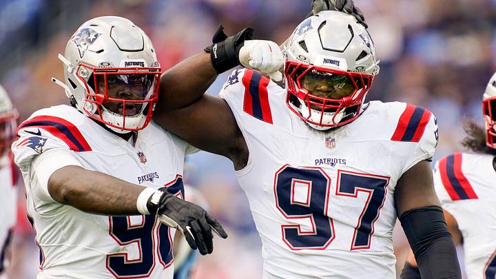New England Patriots defensive end Milton Williams (97) celebrates sacking Tennessee Titans quarterback Cam Ward (1) during the third quarter at Nissan Stadium in Nashville, Tenn., Sunday, Oct. 19, 2025.