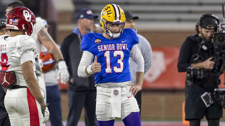 American Team quarterback Garrett Nussmeier (13) of LSU gives a thumbs up during American Senior Bowl practice