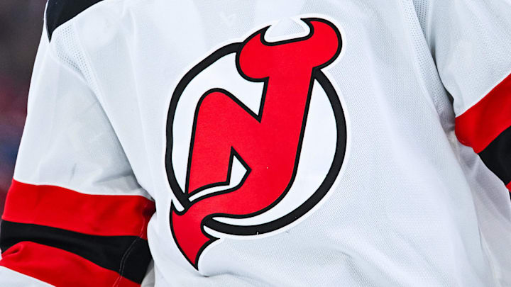 View of a New Jersey Devils logo on a jersey worn by a member of the team during the second period at Bell Centre. Mandatory Credit: David Kirouac-Imagn Images