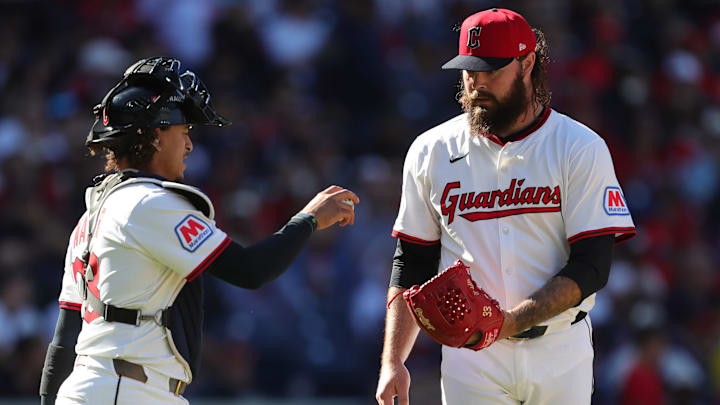 Cleveland Guardians relief pitcher Hunter Gaddis (33) meets with catcher Bo Naylor (23) during Game 2 of the American League wild card series at Progressive Field, Oct. 1, 2025, in Cleveland, Ohio.