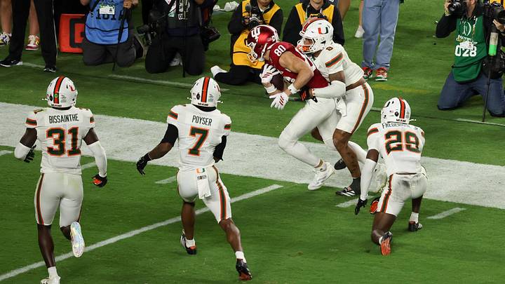 Jan 19, 2026; Miami Gardens, FL, USA; Miami Hurricanes defensive back Jakobe Thomas (8) forces Indiana Hoosiers wide receiver Charlie Becker (80) out of bounds in the second quarter during the College Football Playoff National Championship game at Hard Rock Stadium. Mandatory Credit: Kim Klement Neitzel-Imagn Images