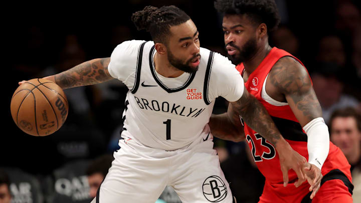Mar 26, 2025; Brooklyn, New York, USA; Brooklyn Nets guard D'Angelo Russell (1) controls the ball against Toronto Raptors guard Jamal Shead (23) during the third quarter at Barclays Center. Mandatory Credit: Brad Penner-Imagn Images