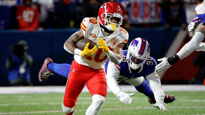 Kansas City Chiefs running back Isiah Pacheco (10) beats a tackle.