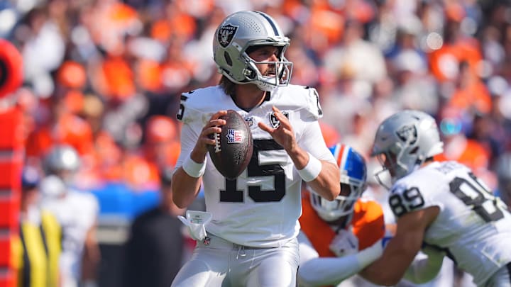 Oct 6, 2024; Denver, Colorado, USA; Las Vegas Raiders quarterback Gardner Minshew (15) prepares to pass in the first quarter against the Denver Broncos at Empower Field at Mile High. Mandatory Credit: Ron Chenoy-Imagn Images Oct 6, 2024; Denver, Colorado, USA; Las Vegas Raiders quarterback Gardner Minshew (15) prepares to pass in the first quarter against the Denver Broncos at Empower Field at Mile High. Mandatory Credit: Ron Chenoy-Imagn Images