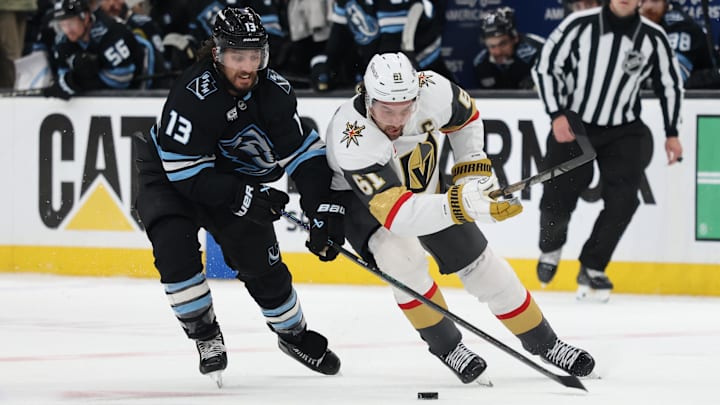 Apr 27, 2026; Salt Lake City, Utah, USA; Utah Mammoth left wing Brandon Tanev (13) and Vegas Golden Knights right wing Mark Stone (61) battle for the puck during overtime in game four of the first round of the 2026 Stanley Cup Playoffs at Delta Center. Mandatory Credit: Rob Gray-Imagn Images