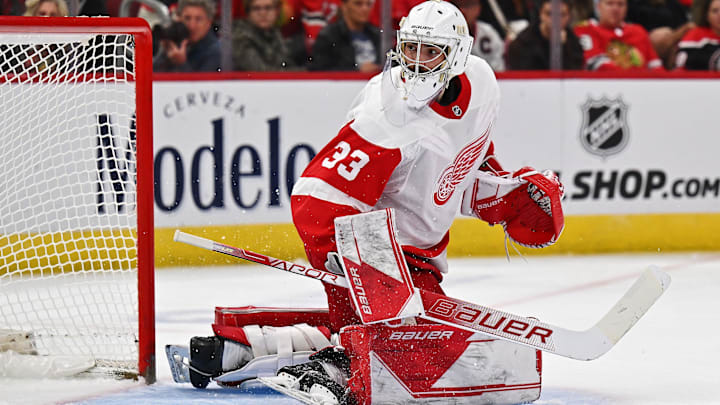 Oct 1, 2022; Chicago, Illinois, USA;  Detroit Red Wings goaltender Sebastian Cossa (33) defends the net against the Chicago Blackhawks at United Center. Mandatory Credit: Jamie Sabau-Imagn Images
