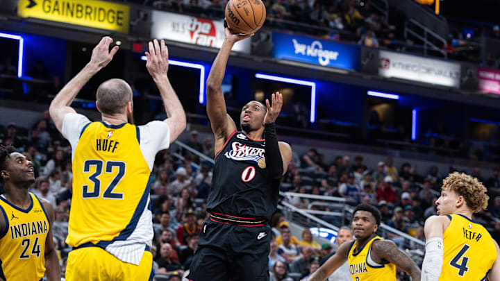 Apr 10, 2026; Indianapolis, Indiana, USA; Philadelphia 76ers guard Tyrese Maxey (0) shoots the ball while Indiana Pacers center Jay Huff (32) defends in the second half at Gainbridge Fieldhouse. Mandatory Credit: Trevor Ruszkowski-Imagn Images