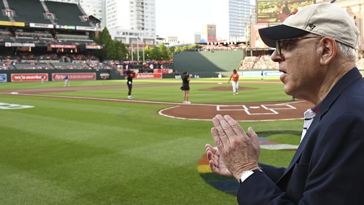 Baltimore Orioles owner David Rubenstein claps while walking on the field before the game against the Texas Rangers at Oriole Park at Camden Yards. 