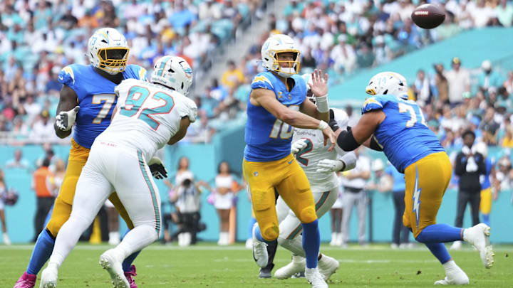 Oct 12, 2025; Miami Gardens, Florida, USA; Los Angeles Chargers quarterback Justin Herbert (10) throws a pass against the Miami Dolphins during the second quarter at Hard Rock Stadium. Mandatory Credit: Rich Storry-Imagn Images