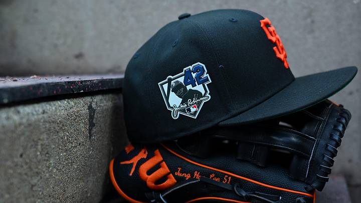 Apr 15, 2026; Cincinnati, Ohio, USA;  A view of a Giants game hat on the dugout steps, with a patch honoring Jackie Robinson during the game between the San Francisco Giants and the Cincinnati Reds at Great American Ball Park. Players and coaches will wear No. 42 in honor of Jackie Robinson Day around the league. Mandatory Credit: Aaron Doster-Imagn Images