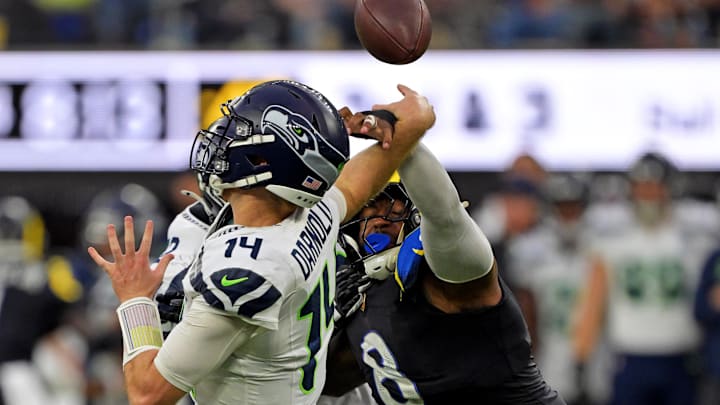 Nov 16, 2025; Inglewood, California, USA; Los Angeles Rams linebacker Jared Verse (8) knocks the ball away from Seattle Seahawks quarterback Sam Darnold (14) for an incomplete pass during the second half at SoFi Stadium. Mandatory Credit: Jayne Kamin-Oncea-Imagn Images