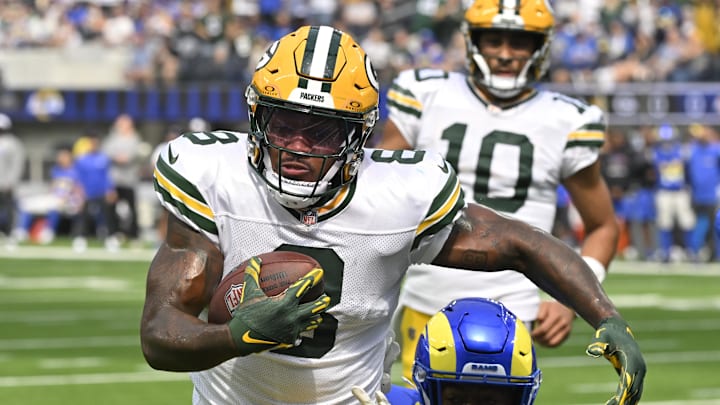 Green Bay Packers running back Josh Jacobs (8) sprints to the end zone past Los Angeles Rams linebacker Jared Verse. Green Bay Packers running back Josh Jacobs (8) sprints to the end zone past Los Angeles Rams linebacker Jared Verse.