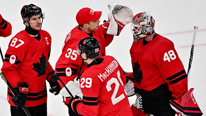 [US, Mexico & Canada customers only] Feb 13, 2026; Milan, Italy; Nathan MacKinnon, Sidney Crosby, Darcy Kuemper and Logan Thompson of Canada celebrate after the match against Switzerland in men's ice hockey group A play during the Milano Cortina 2026 Olympic Winter Games at Milano Santagiulia Ice Hockey Arena. Mandatory Credit: Marton Monus/Reuters via Imagn Images