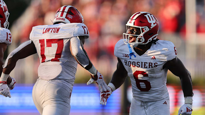 Ty Son Lawton #17 of the Indiana Hoosiers celebrates a touchdown with Justice Ellison #6 against the Northwestern Wildcats during the second half at Martin Stadium on October 05, 2024 in Evanston, Illinois.