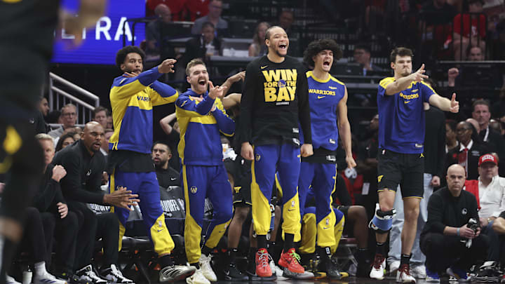 May 4, 2025; Houston, Texas, USA; Golden State Warriors bench players celebrate after a basket by guard Buddy Hield (not pictured) during the second quarter of game seven of the first round for the 2025 NBA Playoffs against the Houston Rockets  at Toyota Center. Mandatory Credit: Troy Taormina-Imagn Images