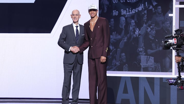 Jun 25, 2025; Brooklyn, NY, USA;  Carter Bryant stands with NBA commissioner Adam Silver after being selected as the 14th pick by the San Antonio Spurs in the first round of the 2025 NBA Draft at Barclays Center. Mandatory Credit: Brad Penner-Imagn Images