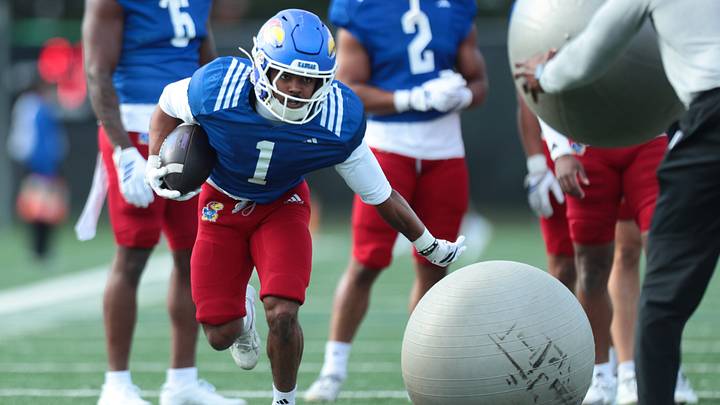 Kansas junior running back Dylan Edwards (1) works on drills during practice at the University of Kansas on Thursday, April 9, 2026. Kansas junior running back Dylan Edwards (1) works on drills during practice at the University of Kansas on Thursday, April 9, 2026.