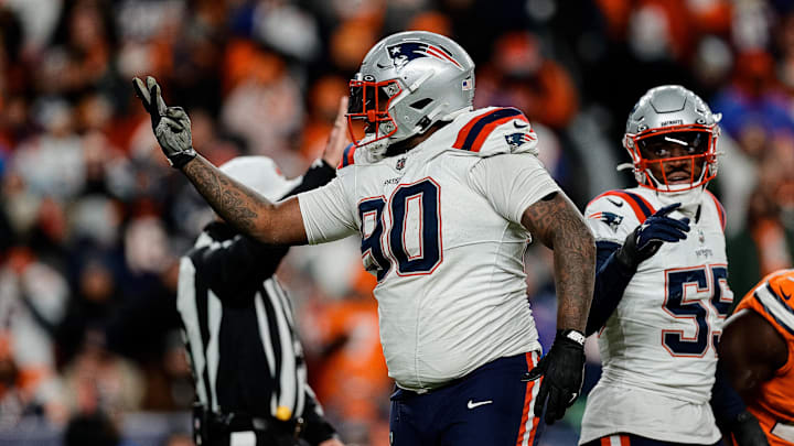 Dec 24, 2023; Denver, Colorado, USA; New England Patriots defensive tackle Christian Barmore (90) reacts after a play ]in the third quarter against the Denver Broncos at Empower Field at Mile High. Mandatory Credit: Isaiah J. Downing-Imagn Images