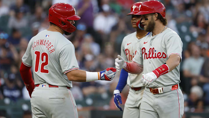 Jun 24, 2024; Detroit, Michigan, USA;  Philadelphia Phillies first baseman Bryce Harper (3) receives congratulations from designated hitter Kyle Schwarber (12) after he hits a three-run home run in the sixth inning against the Detroit Tigers at Comerica Park. Mandatory Credit: Rick Osentoski-USA TODAY Sports
