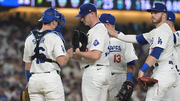 Oct 11, 2024; Los Angeles, California, USA; Los Angeles Dodgers pitcher Evan Phillips (59) is relieved in the seventh inning against the San Diego Padres during game five of the NLDS for the 2024 MLB Playoffs at Dodger Stadium. Mandatory Credit: Jayne Kamin-Oncea-Imagn Images