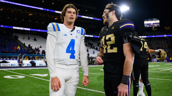 Bruins quarterback Ethan Garbers and Huskies linebacker Carson Bruener, once UW teammates, chat after Friday's game.