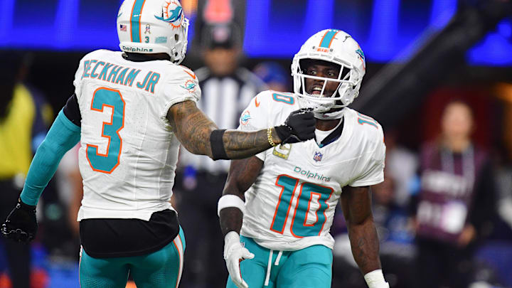 Miami Dolphins wide receiver Tyreek Hill (10) celebrates his touchdown scored against the Los Angeles Rams with wide receiver Odell Beckham Jr. (3) during the second half at SoFi Stadium. 