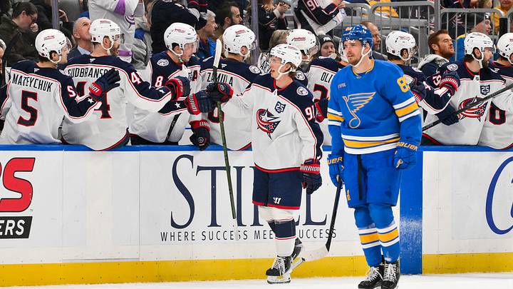 Jan 31, 2026; St. Louis, Missouri, USA; Columbus Blue Jackets center Kent Johnson (91) is congratulated by teammates after scoring against the St. Louis Blues during the second period at Enterprise Center. Mandatory Credit: Jeff Curry-Imagn Images Jan 31, 2026; St. Louis, Missouri, USA; Columbus Blue Jackets center Kent Johnson (91) is congratulated by teammates after scoring against the St. Louis Blues during the second period at Enterprise Center. Mandatory Credit: Jeff Curry-Imagn Images