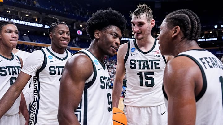 Michigan State guard Trey Fort (9), center left, and guard Jeremy Fears Jr. (1) celebrates 77-69 win over Louisville at the NCAA Tournament Second Round at KeyBank Center in Buffalo on Saturday, March 21, 2026.