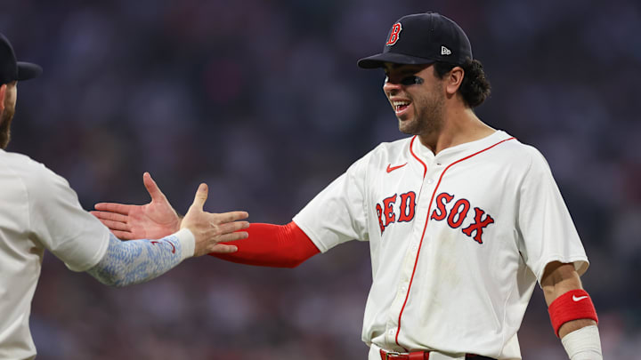 Jun 11, 2025; Boston, Massachusetts, USA; Boston Red Sox third baseman Marcelo Mayer (39) celebrates with Boston Red Sox shortstop Trevor Story (10) during the sixth inning against the Tampa Bay Rays at Fenway Park. Mandatory Credit: Paul Rutherford-Imagn Images