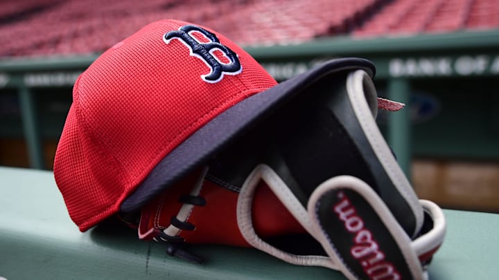 May 18, 2025; Boston, Massachusetts, USA; A Boston Red Sox hat and glove rests on the railing by the dugout prior to a game against the Atlanta Braves at Fenway Park. Mandatory Credit: Bob DeChiara-Imagn Images May 18, 2025; Boston, Massachusetts, USA; A Boston Red Sox hat and glove rests on the railing by the dugout prior to a game against the Atlanta Braves at Fenway Park. Mandatory Credit: Bob DeChiara-Imagn Images