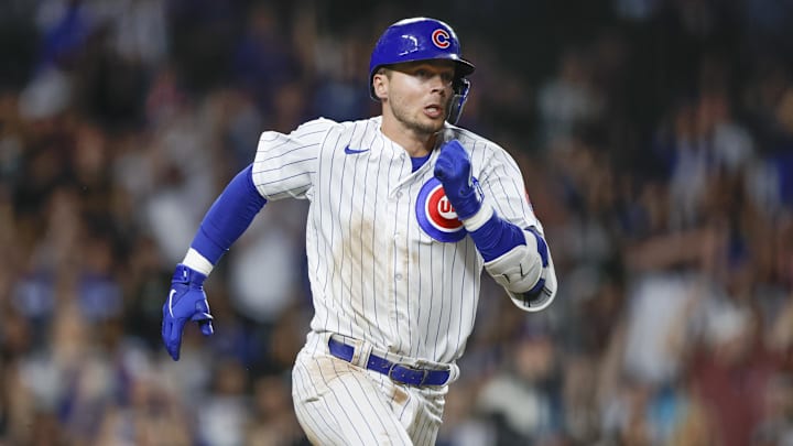 Apr 11, 2023; Chicago, Illinois, USA; Chicago Cubs second baseman Nico Hoerner (2) runs to second base after hitting a two-run double against the Seattle Mariners during the sixth inning at Wrigley Field.